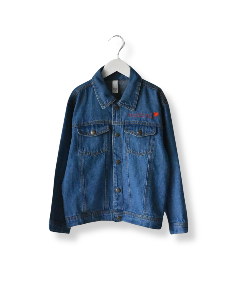 A blue denim jacket for big kids displayed on a hanger, featuring brass colored snap buttons and a front pocket.