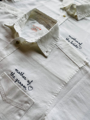 White oversized button-down shirt pre-embroidered with “mother of the groom” on chest