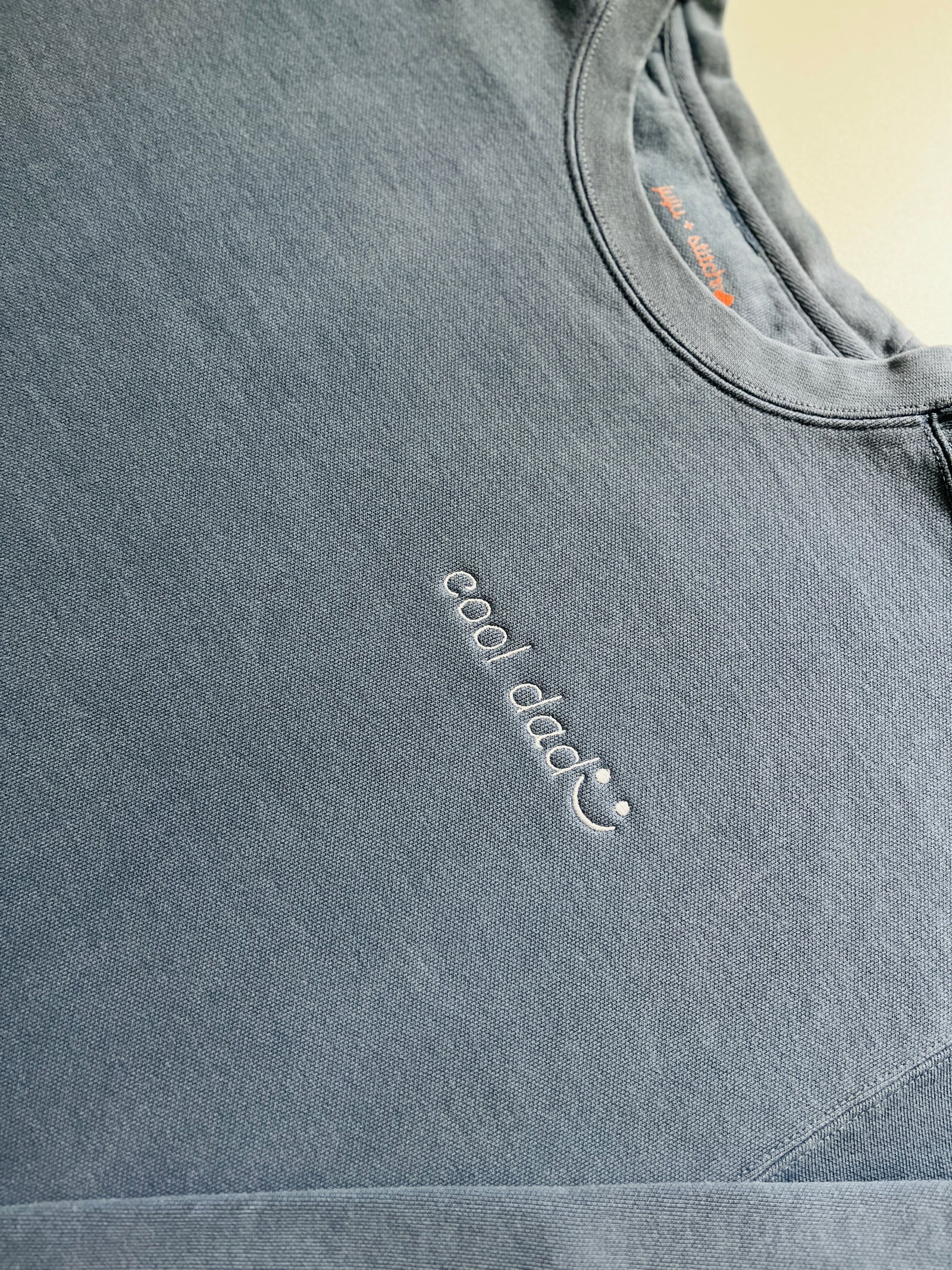 Vintagewash Cool Dad crewneck sweatshirt with pre-embroidered text and optional wrist embroidery detail