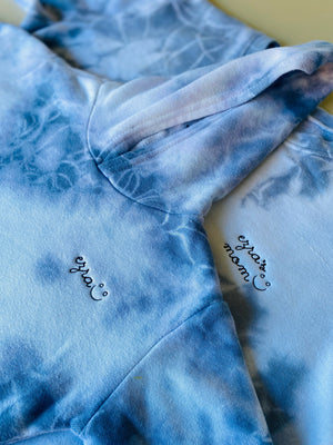 Blue tie-dye hoodie with 'mom' embroidered on it 