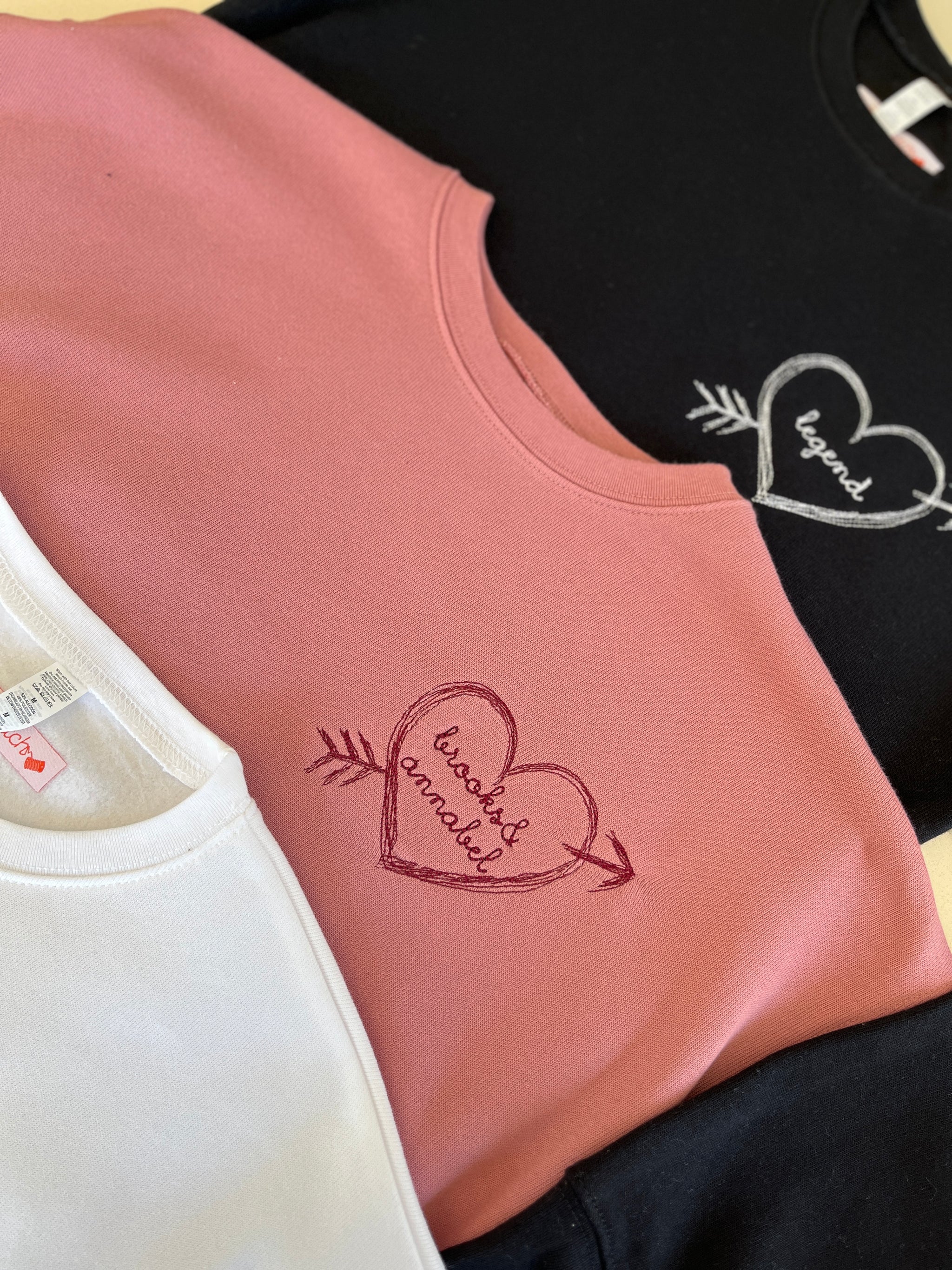 Personalized sweatshirt with heart and arrow embroidery