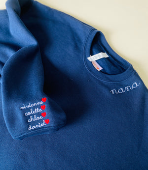 navy sweatshirt with embroidered names on wrist