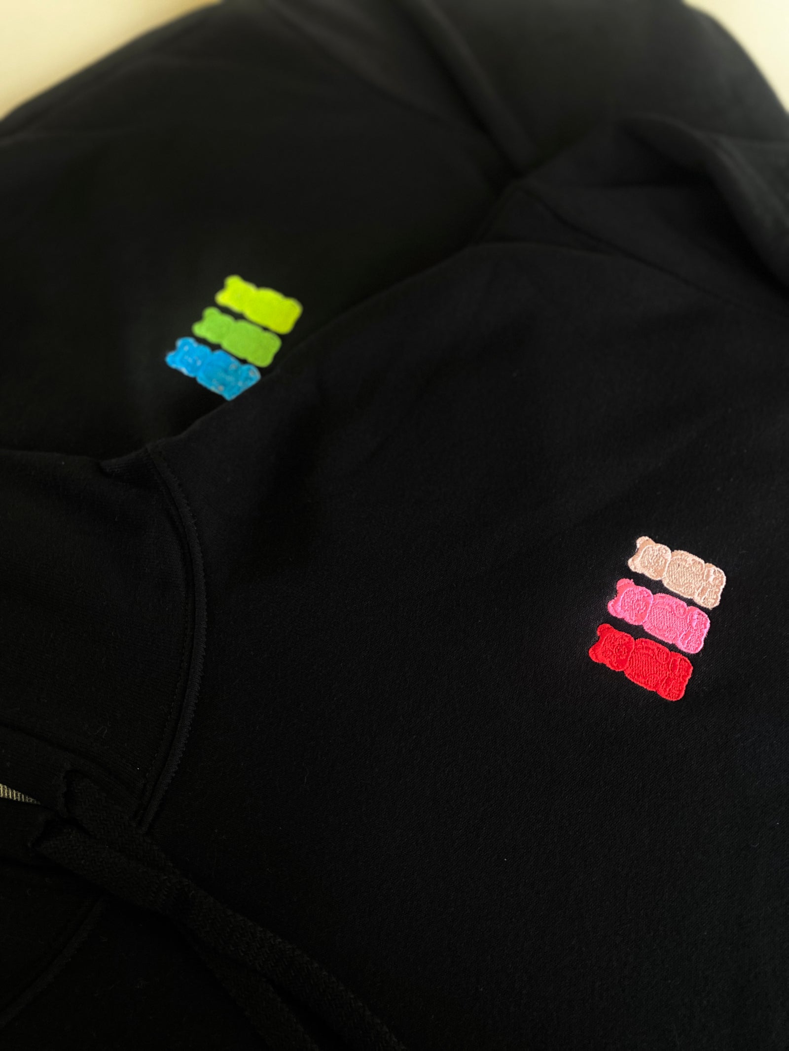 Adult hoodie with embroidered gummy bear design