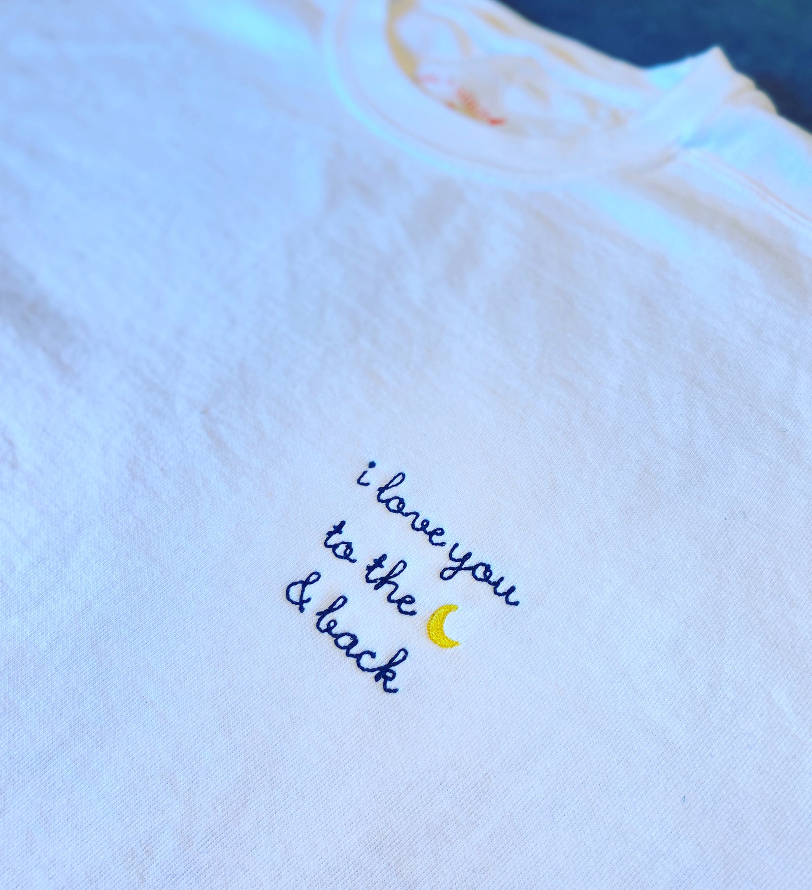 White crewneck embroidered with love you to the moon & back