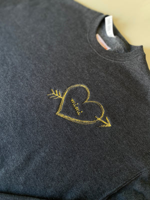 Personalized sweatshirt with heart and arrow embroidery