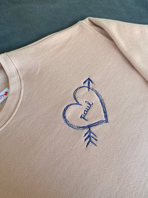 Personalized sweatshirt with heart and arrow embroidery