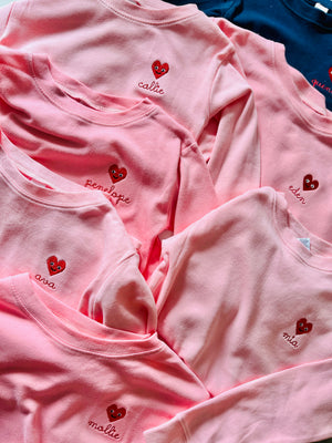 Personalized pajama set with embroidered heart icon