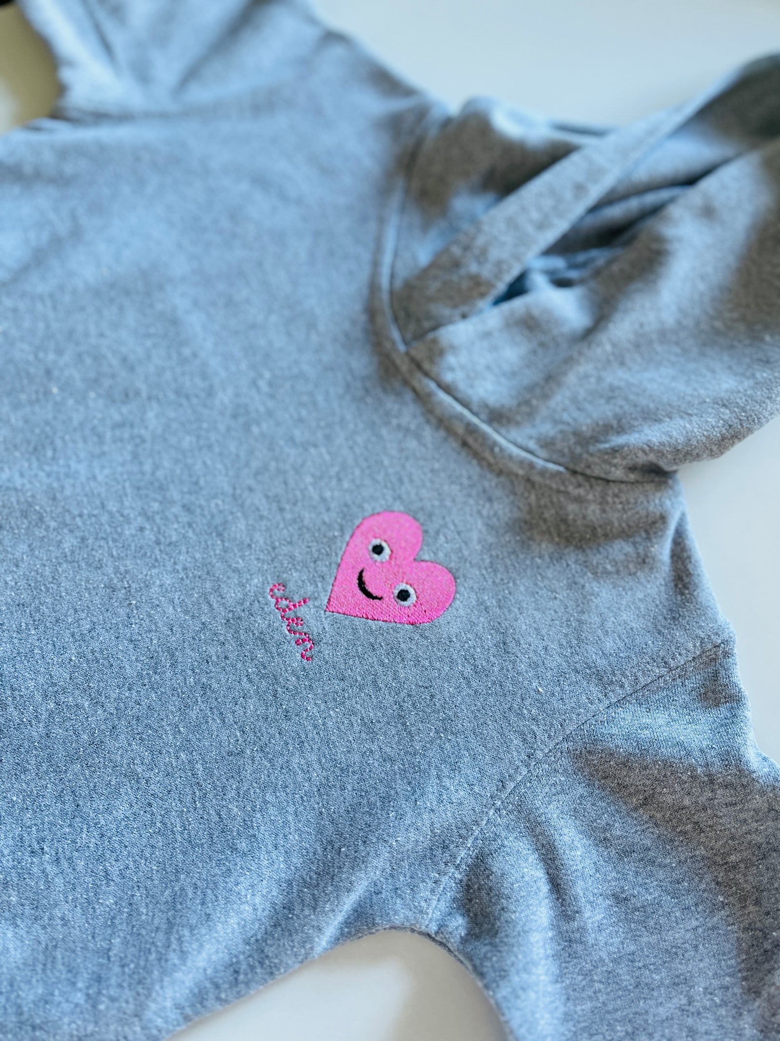 Valentine’s Day kids hoodie – personalized red smiley heart design